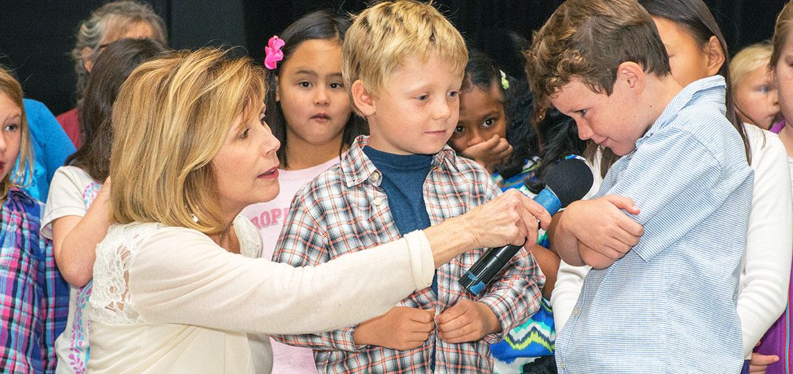 Joni DeGabriele (Mrs. D) of Musical Moments interacting with children at Dixie School Music teacher interacting with children at middle school